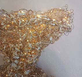 DRESS, detail. Light sculpture, wire and rusted paper pulp